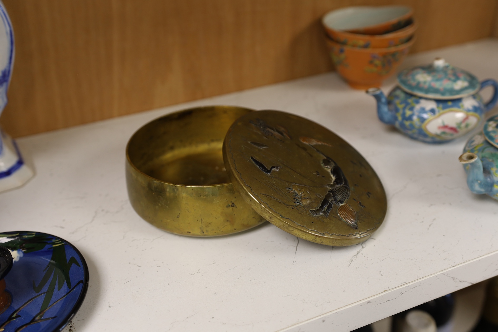 A Japanese bronze and mixed metal mounted box and cover, Meiji period, 13.5cm diameter. Together with a pair of plated jugs Condition - fair to good